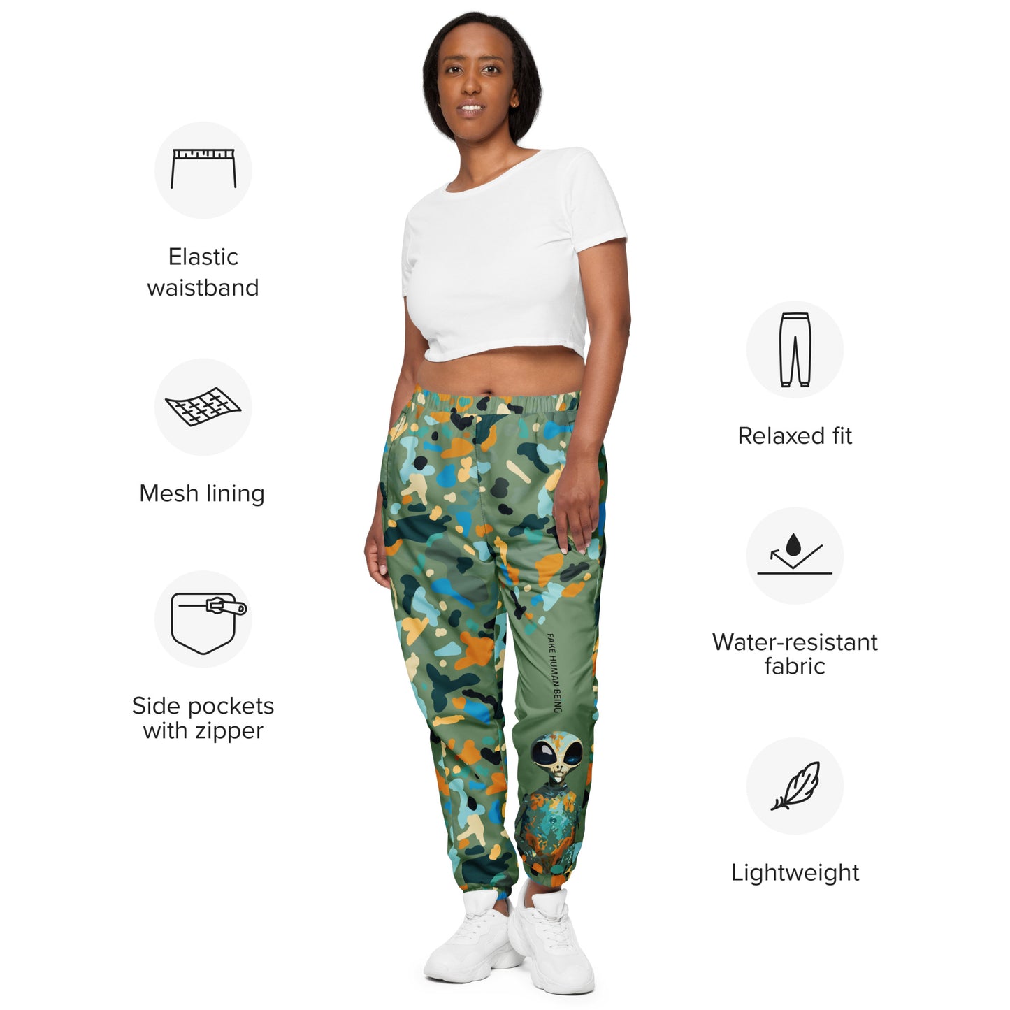 OUT OF SPACE. Unisex water-resistant track pants. FAKE HUMAN BEING.