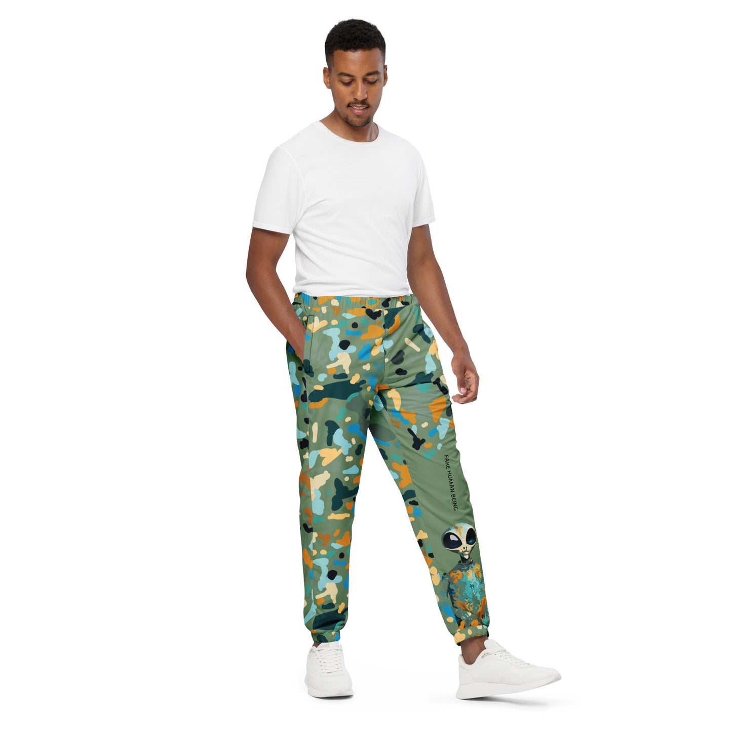 OUT OF SPACE. Unisex water-resistant track pants. FAKE HUMAN BEING.